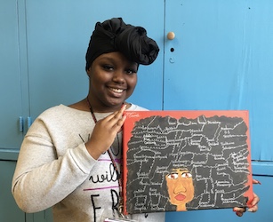 Al Raby Student holding her artwork
